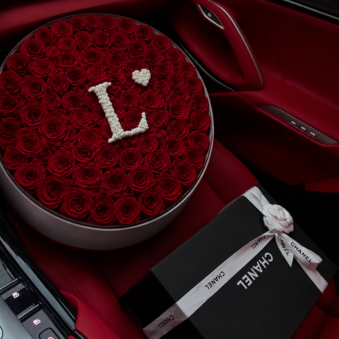 FajiFlowers personalised red rose bouquet in luxury car interior